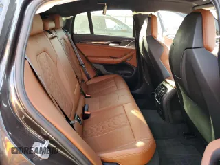 2020 BMW X4 M Competition z VIN 5YMUJ0C05L9B57303, wystawiony jako Copart lot #79167294 z przebiegiem 56 584 mil mil oraz Szkoda całkowita • Salvage title. Historia ofert i sprzedaży dostępna na DreamBid. Obrazek 12.