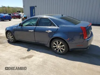 2009 Cadillac CTS AWD with VIN 1G6DH577390123365, listed as a Copart auction lot 54815885 with 141,026 mi miles and Salvage Title. Bid and sale history available at DreamBid. Image 2.