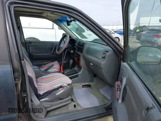1999 Honda Passport LX with VIN 4S6CK58W7X4410782, listed as a IAAI auction lot 41493176 with 276,257 mi miles. Bid and sale history available at carsss.com. Image 5.
