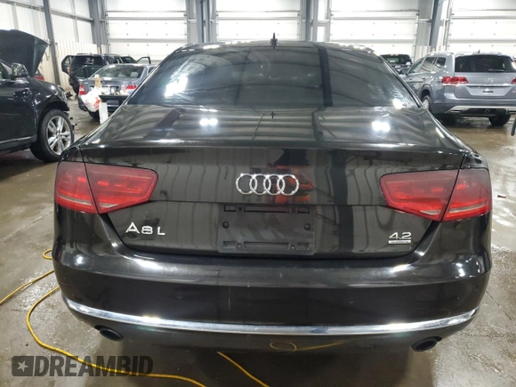 2011 Audi A8 z VIN WAURVAFD8BN005569, wystawiony jako Copart lot #52101065 z przebiegiem 104 893 mil mil oraz Szkody całkowita. Historia ofert i sprzedaży dostępna na DreamBid. Obrazek 6.