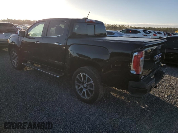 2021 GMC Canyon 2WD Denali with VIN 1GTG5EEN2M1107052, listed as a Copart auction lot 76377704 with 11,696 mi miles and Salvage Title. Bid and sale history available at carsss.com. Image 2.