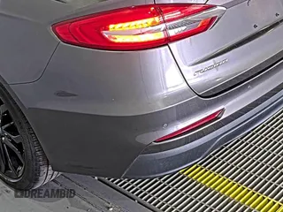 2020 Ford Fusion SE z VIN 3FA6P0HD6LR189762, wystawiony jako IAAI lot #42780149 z przebiegiem 51 099 mil mil oraz . Historia ofert i sprzedaży dostępna na DreamBid. Obrazek 13.