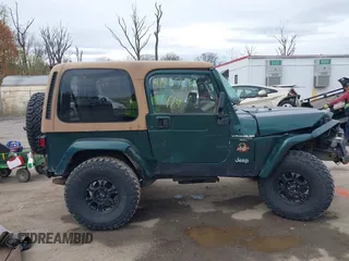 1999 Jeep Wrangler Sahara with VIN 1J4FY49S7XP440582, listed as a IAAI auction lot 41967151 with 163,710 mi miles and . Bid and sale history available at carsss.com. Image 13.