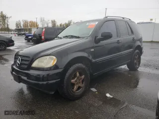 2001 Mercedes-Benz M-Class with VIN 4JGAB54E51A273024, listed as a Copart auction lot 80327264 with 211,120 mi miles and Salvage Title. Bid and sale history available at carsss.com. Image 1.