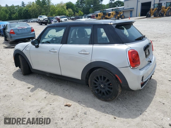 2015 MINI Hardtop 4 Door S with VIN WMWXU3C5XF2B56555, listed as a Copart auction lot 58775215 with 101,426 mi miles and Clean title. Bid and sale history available at DreamBid. Image 2.