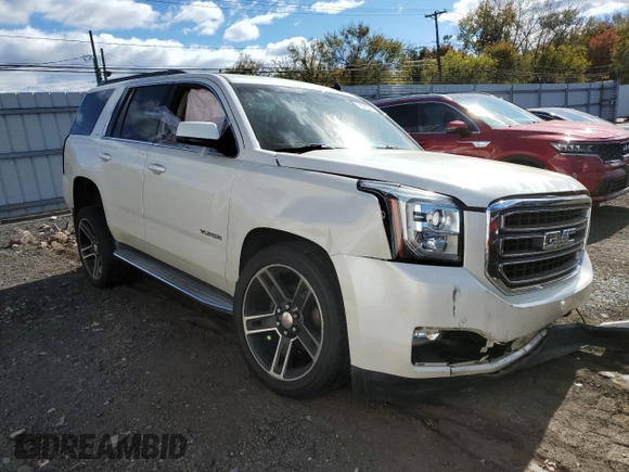 2015 GMC Yukon SLT with VIN 1GKS2BKC3FR143491, listed as a Copart auction lot 76062044 with Not Provided miles and Salvage Title. Bid and sale history available at DreamBid. Image 4.