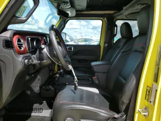 2022 Jeep Wrangler Unlimited Rubicon with VIN 1C4HJXFG3NW214174, listed as a Copart auction lot 74136484 with 5,292 mi miles and Salvage title. Bid and sale history available at DreamBid. Image 7.