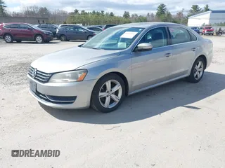 2013 Volkswagen Passat SE w/Sunroof & Nav with VIN 1VWBP7A37DC125598, listed as a IAAI auction lot 42022573 with 149,812 mi miles. Bid and sale history available at carsss.com. Image 2.