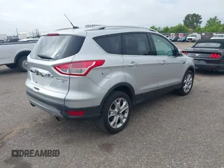 2016 Ford Escape Titanium with VIN 1FMCU9JX3GUC86930, listed as a IAAI auction lot 42582263 with 113,386 mi miles and . Bid and sale history available at DreamBid. Image 4.