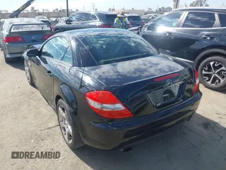 2005 Mercedes-Benz SLK-Class with VIN WDBWK56F85F066196, listed as a IAAI auction lot 41692697 with 197,941 mi miles. Bid and sale history available at carsss.com. Image 3.