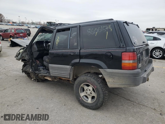 1998 Jeep Grand Cherokee Laredo with VIN 1J4FX58S1WC348125, listed as a Copart auction lot 86061674 with 0 mi miles and Salvage Title. Bid and sale history available at carsss.com. Image 2.