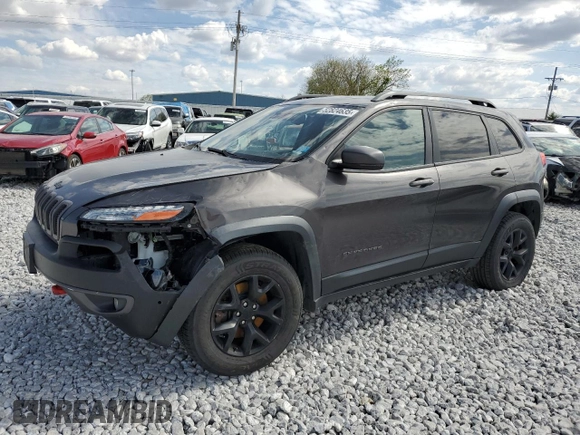 2015 Jeep Cherokee Trailhawk with VIN 1C4PJMBS5FW615845, listed as a Copart auction lot 52824635 with 134,873 mi miles and Salvage Title. Bid and sale history available at carsss.com. Image 1.