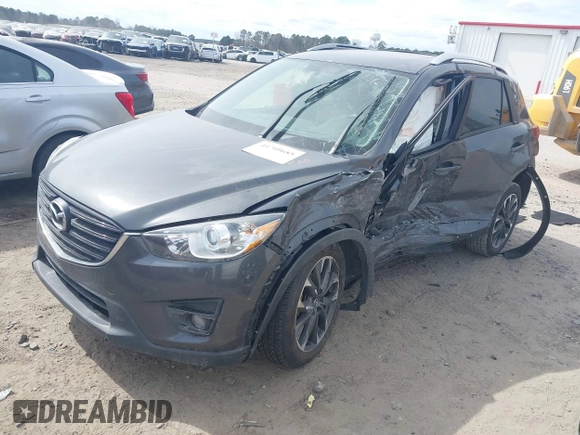 2016 Mazda CX-5 Grand Touring with VIN JM3KE4DY9G0845707, listed as a IAAI auction lot 41709685 with 96,351 mi miles. Bid and sale history available at carsss.com. Image 2.