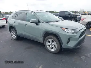 2021 Toyota RAV4 XLE with VIN 2T3W1RFV6MW148931, listed as a IAAI auction lot 42615522 with 55,965 mi miles and . Bid and sale history available at DreamBid. Image 1.