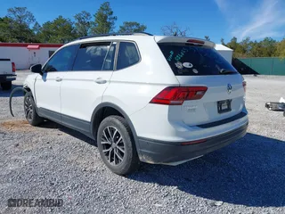 2021 Volkswagen Tiguan S with VIN 3VV1B7AX9MM056025, listed as a IAAI auction lot 41352521 with 98,944 mi miles. Bid and sale history available at carsss.com. Image 3.