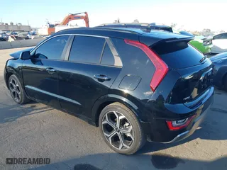 2023 Kia Niro SX Touring with VIN KNDCT3LE6P5038102, listed as a IAAI auction lot 41710555 with 57,669 mi miles. Bid and sale history available at carsss.com. Image 3.