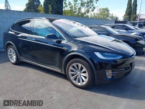 2020 Tesla Model X Long Range with VIN 5YJXCDE20LF265157, listed as a IAAI auction lot 41809572 with 58,599 mi miles. Bid and sale history available at carsss.com. Image 1.