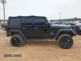 2016 Jeep Wrangler Unlimited Sport z VIN 1C4BJWDG8GL104132, wystawiony jako IAAI lot #41629665 z przebiegiem 86 891 mil mil oraz . Historia ofert i sprzedaży dostępna na DreamBid. Obrazek 13.