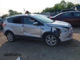 2015 Ford Escape Titanium z VIN 1FMCU0J90FUC02039, wystawiony jako IAAI lot #42369882 z przebiegiem 156 287 mil mil oraz . Historia ofert i sprzedaży dostępna na DreamBid. Obrazek 12.