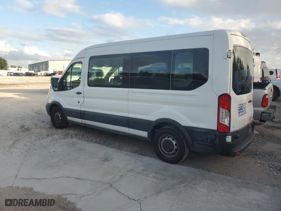 2016 Ford Transit Wagon XL with VIN 1FBZX2CM5GKA21099, listed as a Copart auction lot 77084614 with 128,446 mi miles and Salvage Title. Bid and sale history available at carsss.com. Image 2.