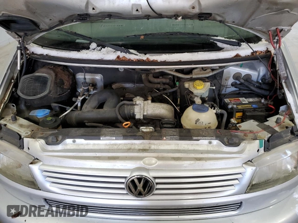 2003 Volkswagen EuroVan MV с VIN WV2NB47073H001005, выставлен на аукционе Copart как лот 87284844 с пробегом 283 979 миль миль и Чистый • Clean title. История ставок и продаж доступна на DreamBid. Изображение 12.