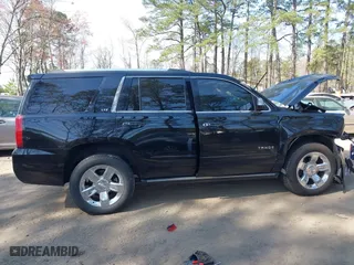 2015 Chevrolet Tahoe LTZ with VIN 1GNSKCKC2FR101306, listed as a IAAI auction lot 41909631 with 218,102 mi miles. Bid and sale history available at carsss.com. Image 13.