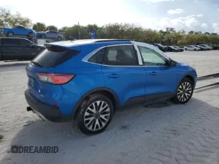 2020 Ford Escape Titanium z VIN 1FMCU9J95LUA37315, wystawiony jako Copart lot #58873545 z przebiegiem Nie podano mil oraz Szkoda całkowita • Salvage title. Historia ofert i sprzedaży dostępna na DreamBid. Obrazek 3.