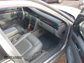 2002 Cadillac Seville Touring STS z VIN 1G6KY54902U102873, wystawiony jako IAAI lot #39710788 z przebiegiem 120 116 mil mil oraz . Historia ofert i sprzedaży dostępna na DreamBid. Obrazek 5.