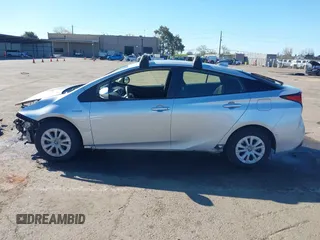 2021 Toyota Prius L Eco with VIN JTDKAMFU5M3130478, listed as a IAAI auction lot 41867606 with 52,223 mi miles. Bid and sale history available at carsss.com. Image 15.