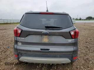 2019 Ford Escape Titanium z VIN 1FMCU9J99KUC31182, wystawiony jako Copart lot #60972815 z przebiegiem 94 464 mil mil oraz Szkoda całkowita • Salvage title. Historia ofert i sprzedaży dostępna na DreamBid. Obrazek 6.