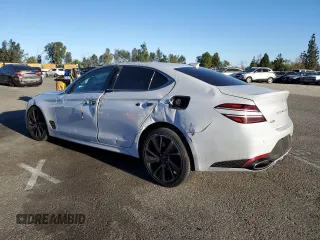 2022 Genesis G70 3.3T with VIN KMTG54TE9NU081984, listed as a Copart auction lot 79634704 with 63,169 mi miles and Salvage Title. Bid and sale history available at DreamBid. Image 2.