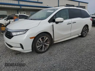 2023 Honda Odyssey Touring with VIN 5FNRL6H82PB018118, listed as a Copart auction lot 86182064 with 56,499 mi miles and Salvage title. Bid and sale history available at DreamBid. Image 1.
