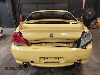2006 Hyundai Tiburon GT z VIN KMHHN65F56U225936, wystawiony jako IAAI lot #41695280 z przebiegiem 121 110 mil mil oraz . Historia ofert i sprzedaży dostępna na DreamBid. Obrazek 16.