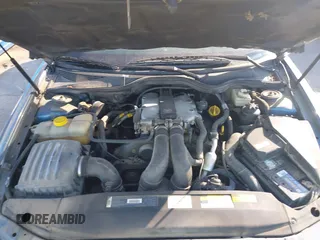 1998 Cadillac Catera z VIN W06VR52R0WR019027, wystawiony jako IAAI lot #42021502 z przebiegiem 124 903 mil mil oraz . Historia ofert i sprzedaży dostępna na DreamBid. Obrazek 10.