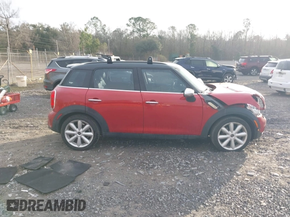 2015 MINI Countryman S with VIN WMWZC3C50FWT05122, listed as a IAAI auction lot 41572503 with 120,885 mi miles and . Bid and sale history available at DreamBid. Image 13.