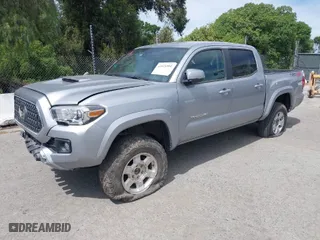 2019 Toyota Tacoma 4WD SR with VIN 3TMCZ5AN4KM194526, listed as a IAAI auction lot 42021504 with 87,767 mi miles. Bid and sale history available at carsss.com. Image 2.