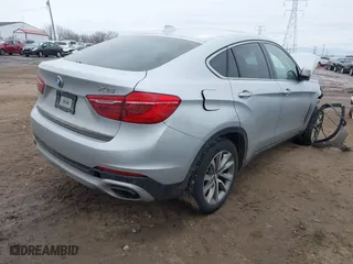 2018 BMW X6 xDrive35i with VIN 5UXKU2C50J0X49445, listed as a IAAI auction lot 41449077 with 130,912 mi miles. Bid and sale history available at carsss.com. Image 4.