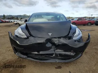 2019 Tesla Model 3 Mid Range with VIN 5YJ3E1EA3KF399335, listed as a Copart auction lot 49005185 with 38,270 mi miles and Salvage Title. Bid and sale history available at carsss.com. Image 5.