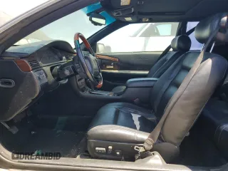 2002 Cadillac Eldorado Touring ETC z VIN 1G6ET12902B105467, wystawiony jako Copart lot #57694675 z przebiegiem Nie podano mil oraz Szkody całkowita. Historia ofert i sprzedaży dostępna na DreamBid. Obrazek 7.