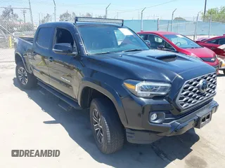 2022 Toyota Tacoma SR5 z VIN 3TMDZ5BN6NM123917, wystawiony jako IAAI lot #42206746 z przebiegiem 23 745 mil mil oraz . Historia ofert i sprzedaży dostępna na DreamBid. Obrazek 1.