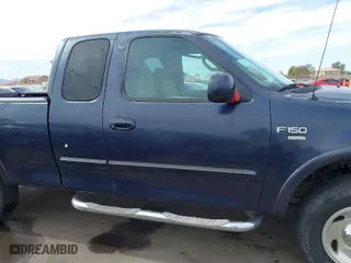 2000 Ford F-150 XL with VIN 1FTRX18L2YKA10388, listed as a IAAI auction lot 41526430 with 144,480 mi miles. Bid and sale history available at carsss.com. Image 13.