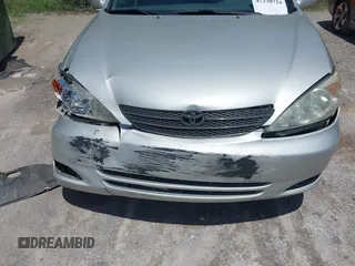 2002 Toyota Camry LE z VIN 4T1BE32K02U630523, wystawiony jako IAAI lot #42330724 z przebiegiem 138 459 mil mil oraz . Historia ofert i sprzedaży dostępna na DreamBid. Obrazek 6.