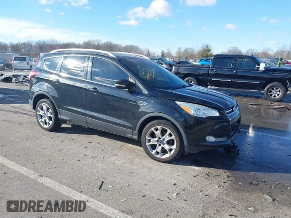 2015 Ford Escape Titanium with VIN 1FMCU0JX8FUC34459, listed as a IAAI auction lot 41394012 with 154,077 mi miles. Bid and sale history available at carsss.com. Image 1.