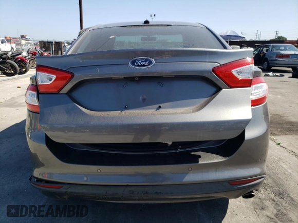 2013 Ford Fusion SE Hybrid z VIN 3FA6P0LUXDR362711, wystawiony jako Copart lot #57060425 z przebiegiem 155 031 mil mil oraz Szkoda całkowita • Salvage title. Historia ofert i sprzedaży dostępna na DreamBid. Obrazek 6.
