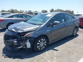 2021 Toyota Prius LE with VIN JTDKAMFPXM3170372, listed as a IAAI auction lot 42661609 with 47,977 mi miles and . Bid and sale history available at DreamBid. Image 2.