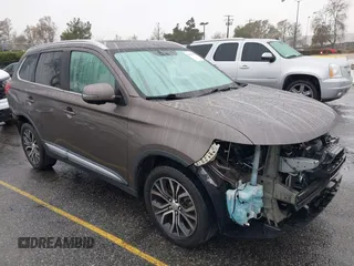 2018 Mitsubishi Outlander SE z VIN JA4AD3A3XJZ020282, wystawiony jako IAAI lot #41516525 z przebiegiem 96 790 mil mil oraz . Historia ofert i sprzedaży dostępna na DreamBid. Obrazek 1.