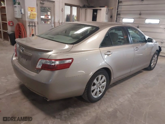 2009 Toyota Camry Hybrid with VIN JTNBB46K793052834, listed as a IAAI auction lot 41795017 with 243,223 mi miles. Bid and sale history available at carsss.com. Image 4.