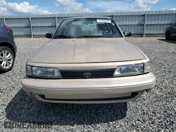1991 Toyota Camry DLX z VIN 4T1SV21E5MU415356, wystawiony jako Copart lot #74465914 z przebiegiem 74 592 mil mil oraz Szkoda całkowita • Salvage title. Historia ofert i sprzedaży dostępna na DreamBid. Obrazek 5.
