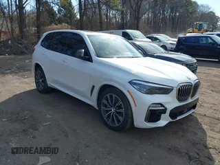 2020 BMW X5 M50i with VIN 5UXJU4C06LLE45651, listed as a IAAI auction lot 41618355 with 70,885 mi miles. Bid and sale history available at carsss.com. Image 1.