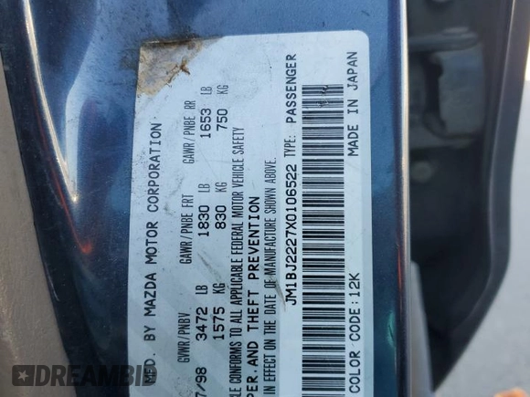 1999 Mazda Protege DX z VIN JM1BJ2227X0106522, wystawiony jako Copart lot #52423565 z przebiegiem 206 260 mil mil oraz Szkoda całkowita • Salvage title. Historia ofert i sprzedaży dostępna na DreamBid. Obrazek 12.